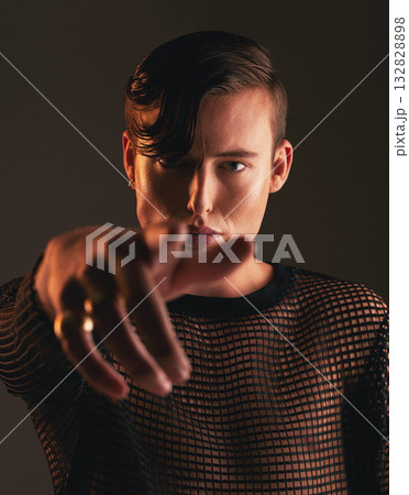 Gender neutral person, fashion and hand on dark background, trendy and edgy art. Creative, gen z and beauty, pointing and sexy with cosmetics, young and non binary with designer clothes in portrait 132828898