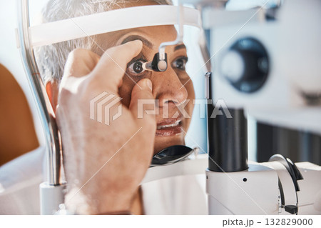 Senior eye zoom, retina check and medical eyes test of elderly woman at doctor consultation. Vision, healthcare focus and old female patient with consulting wellness expert for lens and glaucoma exam Senior eye zoom, retina check and medical eyes test of elderly woman at doctor consultation. Vision, healthcare focus and old female patient with consulting wellness expert for lens and glaucoma exam 132829000