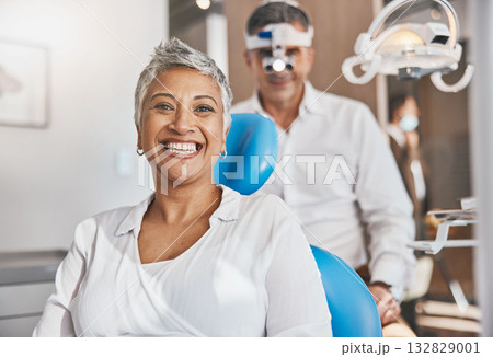 Portrait, happy and dental with a woman patient in a doctor office for oral hygiene or health. Smile, teeth and healthcare with a senior female sitting in a chair at the dentist for hygiene 132829001