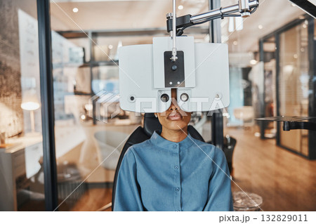 Optometry, eye exam and black woman for vision, healthcare test and optical assessment for glasses. Ophthalmology, optometrist clinic and patient with medical equipment, phoropter and lens for eyes 132829011