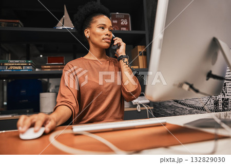 Telephone, office and business woman on computer working on corporate project while on call. Professional, career and African female employee doing research on desktop for company report in workplace Telephone, office and business woman on computer working on corporate project while on call. Professional, career and African female employee doing research on desktop for company report in workplace 132829030