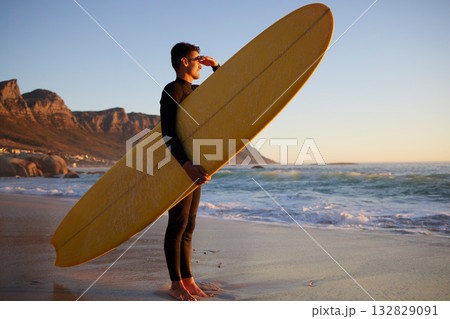 Surfer, man and beach with looking, waves and hand by eyes for safety from sun, thinking or planning morning. Ocean athlete, surfboard or water for fitness, sports and tropical adventure for exercise 132829091