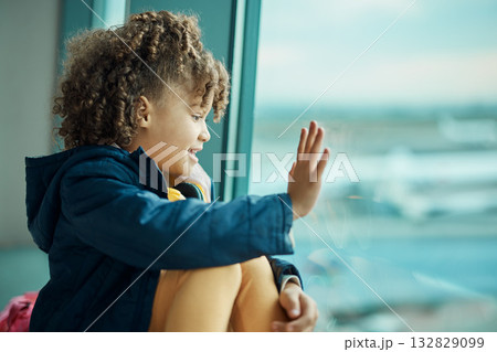Girl child, wave and airport window for greeting, goodbye and smile for airplane, international transport and travel. Kid, happy and hand gesture by glass for global immigration, young and African Girl child, wave and airport window for greeting, goodbye and smile for airplane, international transport and travel. Kid, happy and hand gesture by glass for global immigration, young and African 132829099
