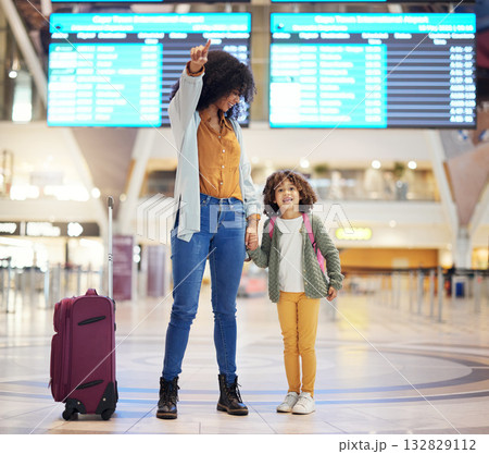 Airport, suitcase and mother with child show travel journey for holiday, vacation or immigration. Black family or mom with girl kid in lobby with luggage excited for flight together holding hands 132829112