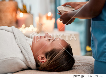 Beauty, skincare and woman getting a face massage with oil for self care, cosmetic and self care. Health, spa and female doing a luxury facial treatment for glowing and healthy skin by wellness salon Beauty, skincare and woman getting a face massage with oil for self care, cosmetic and self care. Health, spa and female doing a luxury facial treatment for glowing and healthy skin by wellness salon 132829165