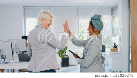 Senior, CEO or business women high five for support, team work or sales goals at an agency office. Smile, mature lady or happy employees winning with motivation, partnership or mission for success 132829279