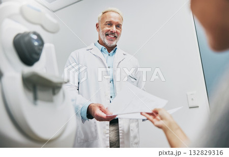 Ophthalmology, consulting and doctor with a patient for results, vision help and surgery information. Healthcare, communication and mature ophthalmologist talking to a woman about advice on eyes Ophthalmology, consulting and doctor with a patient for results, vision help and surgery information. Healthcare, communication and mature ophthalmologist talking to a woman about advice on eyes 132829316