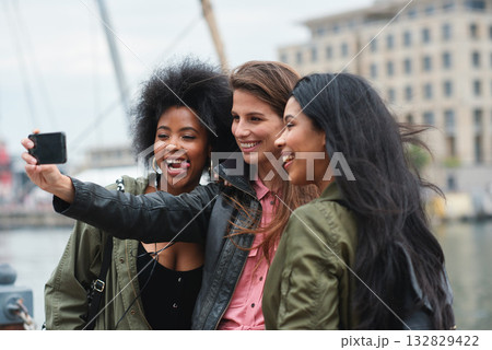 Selfie, travel or bonding with tourist friends taking a picture outdoor together in a foreign city abroad. Happy, smile or diversity with a group of women overseas on vacation posting on social media Selfie, travel or bonding with tourist friends taking a picture outdoor together in a foreign city abroad. Happy, smile or diversity with a group of women overseas on vacation posting on social media 132829422