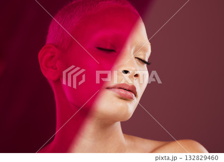 Makeup, cosmetics and woman with a red light for creativity isolated on a purple background in studio. Wellness, peace and model with clear skin, clean complexion and beauty glow on a backdrop 132829460