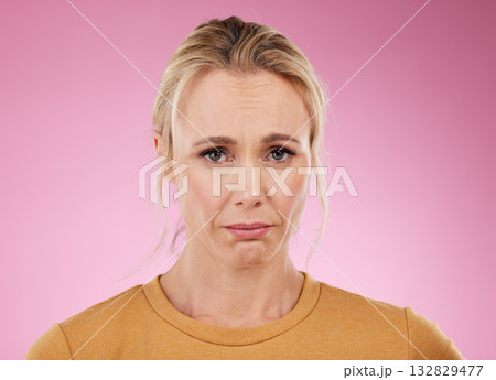 Portrait, woman and sad with mental health, depression and lady against studio background. Face, mature female and stress with anxiety, fatigue and suffering from loneliness, anxious and problems 132829477