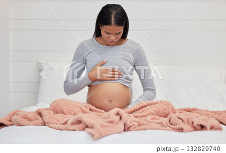 Pregnant, hands on stomach and mother in bed holding abdomen for baby, infant and child affection at home. Pregnancy love, family and excited, loving and happy woman rest, relax and calm in bedroom Pregnant, hands on stomach and mother in bed holding abdomen for baby, infant and child affection at home. Pregnancy love, family and excited, loving and happy woman rest, relax and calm in bedroom 132829740