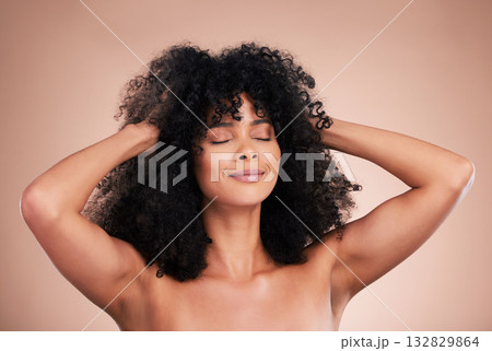 Hair care, beauty and black woman face in studio for shampoo growth and shine. Aesthetic model with natural curly afro for luxury cosmetics, facial skincare and makeup glow on gradient background Hair care, beauty and black woman face in studio for shampoo growth and shine. Aesthetic model with natural curly afro for luxury cosmetics, facial skincare and makeup glow on gradient background 132829864