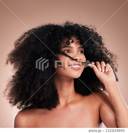 Hair in hands, beauty and black woman with smile on brown background for wellness, shine and natural glow. Salon, luxury treatment and happy girl face with curly hairstyle, texture and afro growth 132829945