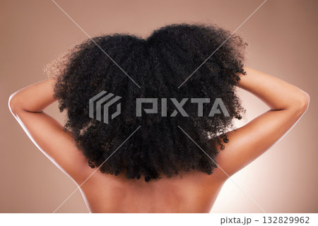 Hair, black woman with afro and beauty, haircare and natural cosmetics, back on studio background. Female, cosmetic treatment with curly hairstyle, rear view and texture, person arms with grooming Hair, black woman with afro and beauty, haircare and natural cosmetics, back on studio background. Female, cosmetic treatment with curly hairstyle, rear view and texture, person arms with grooming 132829962