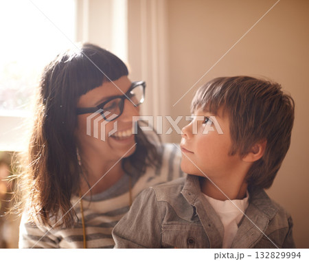 Love, mother and son bonding, happiness and conversation at home, funny and laughing. Family, female parent and happy mama with a male child, boy and kid with joy, loving and relax in a living room 132829994