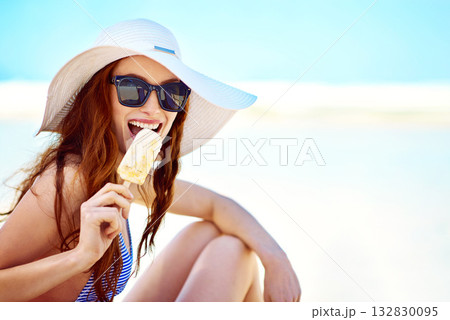 Popsicle, sunglasses and portrait of woman at beach on vacation, holiday travel and mockup in summer hat. Happiness, ice cream and female tourist eating by ocean shore and enjoying snack in Australia Popsicle, sunglasses and portrait of woman at beach on vacation, holiday travel and mockup in summer hat. Happiness, ice cream and female tourist eating by ocean shore and enjoying snack in Australia 132830095