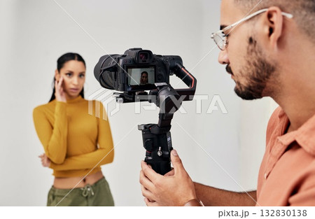 Photography, woman and photographer or cameraman with fashion model in studio for creative, capture and shoot. Media, backstage and professional man with camera, equipment and girl for photoshoot Photography, woman and photographer or cameraman with fashion model in studio for creative, capture and shoot. Media, backstage and professional man with camera, equipment and girl for photoshoot 132830138