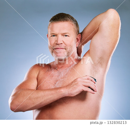 Man, shaving armpit and skincare hygiene, grooming or body care against a studio background. Portrait of elderly male model smiling in satisfaction for shave, hair removal or clean cosmetic treatment Man, shaving armpit and skincare hygiene, grooming or body care against a studio background. Portrait of elderly male model smiling in satisfaction for shave, hair removal or clean cosmetic treatment 132830213