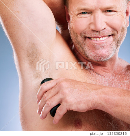 Man, smile and shaving armpit in skincare hygiene, grooming or hair removal against a studio background. Portrait of elderly male smiling in beauty epilation for under arm shave and clean cosmetics Man, smile and shaving armpit in skincare hygiene, grooming or hair removal against a studio background. Portrait of elderly male smiling in beauty epilation for under arm shave and clean cosmetics 132830216