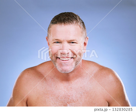 Facial, man smile and portrait of a mature beauty model in a blue background studio with mockup. Skincare, cosmetics wellness and face treatment of a senior person with happiness from self care glow Facial, man smile and portrait of a mature beauty model in a blue background studio with mockup. Skincare, cosmetics wellness and face treatment of a senior person with happiness from self care glow 132830285