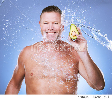 Portrait, water splash with man and avocado for skincare, eco friendly and vegan beauty cosmetics on blue background. Hygiene, hydration and mature male smile, detox facial and fruit with face care Portrait, water splash with man and avocado for skincare, eco friendly and vegan beauty cosmetics on blue background. Hygiene, hydration and mature male smile, detox facial and fruit with face care 132830301