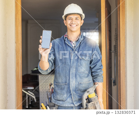 Construction worker, man in portrait and phone, screen with mockup and contact, digital marketing and handyman. Home renovation, maintenance and industry trade promo with product placement advert 132830371