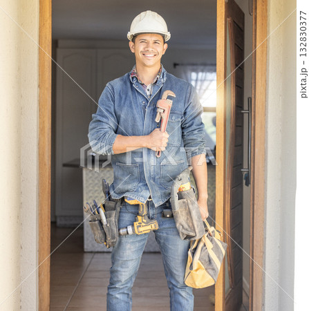 Handyman smile in portrait, maintenance and tools with construction and home renovation with builder. Professional, contractor and DIY skills, architecture and wrench, male with helmet for safety 132830377