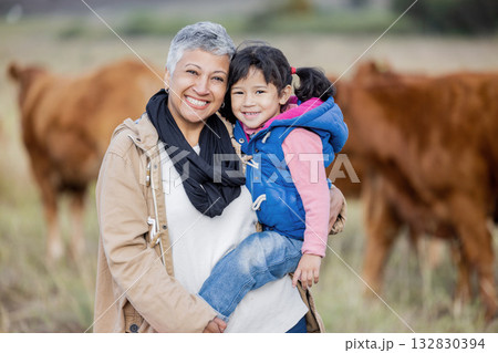 Bonding, happy and portrait of a grandmother with child on a farm for farming experience in South Africa. Nature, love and senior woman with a girl on countryside for agriculture and sustainability 132830394