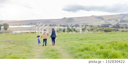 Agriculture, field in countryside with family walking on farm and back view, green and sustainability with agro. Fresh air, farming and farmer with people outdoor, holding hands and environment Agriculture, field in countryside with family walking on farm and back view, green and sustainability with agro. Fresh air, farming and farmer with people outdoor, holding hands and environment 132830422