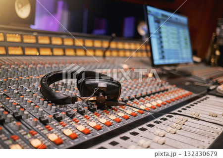 Sound board, music and production with headphones in recording studio with creativity and audio equipment. Mixing console, dj and technology with art, amplifier and produce song with entertainment 132830679