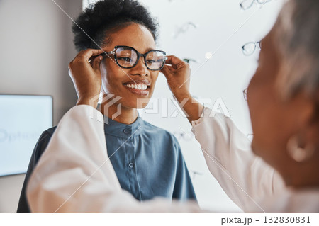 Glasses check, black woman and customer with store worker and optician looking at lense. Eye consulting, smile and eyewear assessment in a frame shop for vision test and prescription exam for eyes Glasses check, black woman and customer with store worker and optician looking at lense. Eye consulting, smile and eyewear assessment in a frame shop for vision test and prescription exam for eyes 132830831