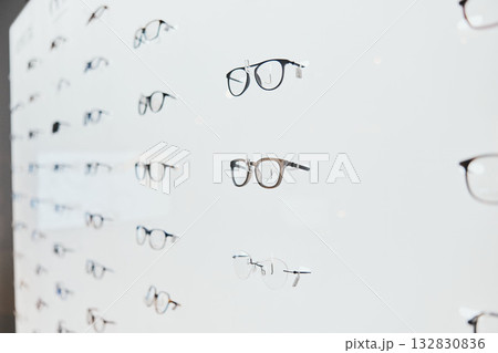 Glasses, frame choice and retail sale in a healthcare, eye wellness and wellness store with no people. Shop stock, eyewear and consumer products on a display stand for shopping and buying in market 132830836