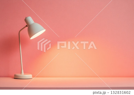 Smooth Peach Colored Wallpaper with Modern Desk Lamp and Warm Lighting Effect Smooth Peach Colored Wallpaper with Modern Desk Lamp and Warm Lighting Effect 132831602