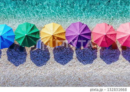 Colorful Beach Umbrellas in a Neat Row Against a Crystal Clear Ocean Background 132831668