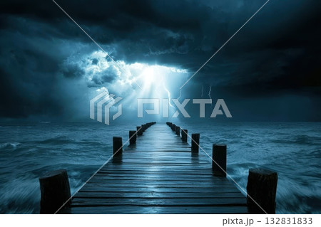 Dramatic Dark Stormy Sky Illuminated by Single Ray of Sunlight Breaking Through Clouds 132831833