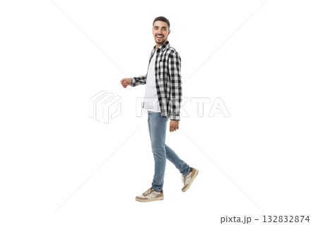 Smiling young man in casual attire walking forward, isolated, PNG Smiling young man in casual attire walking forward, isolated, PNG 132832874