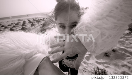 A Stunning Dynamic Photo Capturing a Model Posed in a Surreal and Dreamlike Landscape 132833872