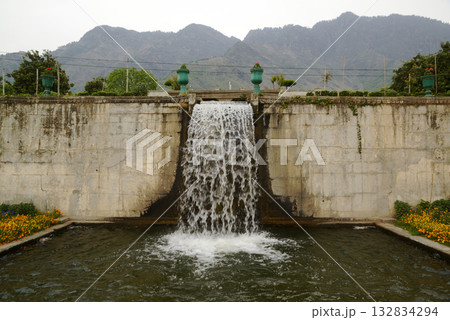 Waterfall in the Nishat garden Bagh is a popular tourist attraction, Nishat Bagh is a 12-tiered terraced garden located near the famous Dal Lake in Srinagar. It is the second largest Mughal garden. Waterfall in the Nishat garden Bagh is a popular tourist attraction, Nishat Bagh is a 12-tiered terraced garden located near the famous Dal Lake in Srinagar. It is the second largest Mughal garden. 132834294