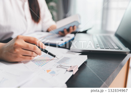 Business woman analyze calculate company financial, tax results office accounting statistics analytical research. calculating business balance prepare tax reduction. Tax deduction planning concept. Business woman analyze calculate company financial, tax results office accounting statistics analytical research. calculating business balance prepare tax reduction. Tax deduction planning concept. 132834967