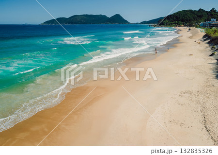 Beach and blue ocean with waves in Brazil. Aerial view of Morro das Pedras 132835326