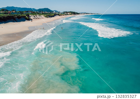 Beach and blue ocean with waves on sunny day in Brazil. Drone view 132835327