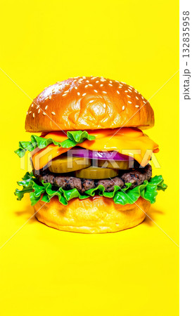 Delicious burger on an isolated yellow background Delicious burger on an isolated yellow background 132835958