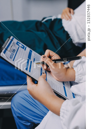 Nurse measuring blood pressure of elderly woman at table, closeup. Assisting senior generation Nurse measuring blood pressure of elderly woman at table, closeup. Assisting senior generation 132837446
