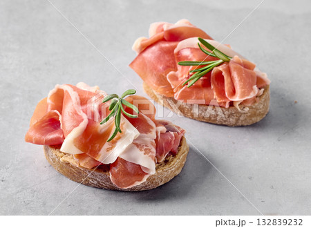 two sandwiches with prosciutto 132839232