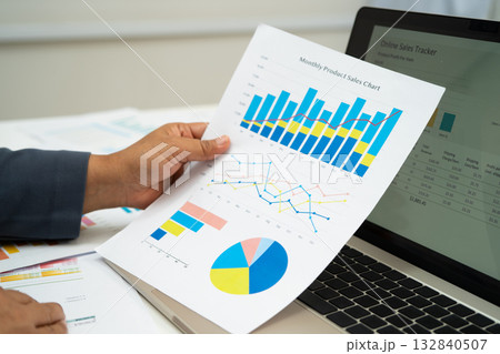 Asian business woman working with financial graph. Asian business woman working with financial graph. 132840507