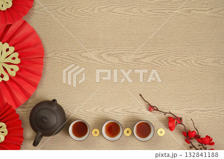 Traditional Chinese tea ceremony with red fans and teacups Traditional Chinese tea ceremony with red fans and teacups 132841188