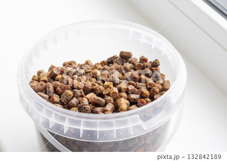 Close shot of the bee bread in the plastic container 132842189