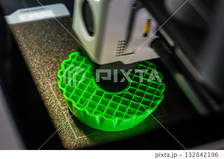 3d printer printing an object on the tray with pla filament, corn starch, non-waterproof filament 132842196