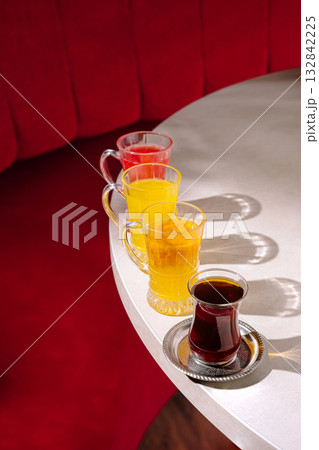 Colorful drinks served on a table in a cozy cafe setting Colorful drinks served on a table in a cozy cafe setting 132842225