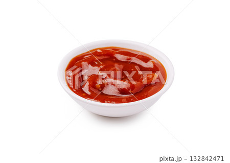 Bright red ketchup in a small white bowl on a clean surface perfect for dipping Bright red ketchup in a small white bowl on a clean surface perfect for dipping 132842471